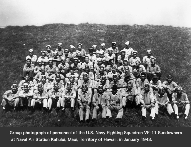 Group photograph of personnel of the U.S. Navy Fighting Squadron VF-11 Sundowners at Naval Air Station Kahului, Maui, Territory of Hawaii, in January 1943.